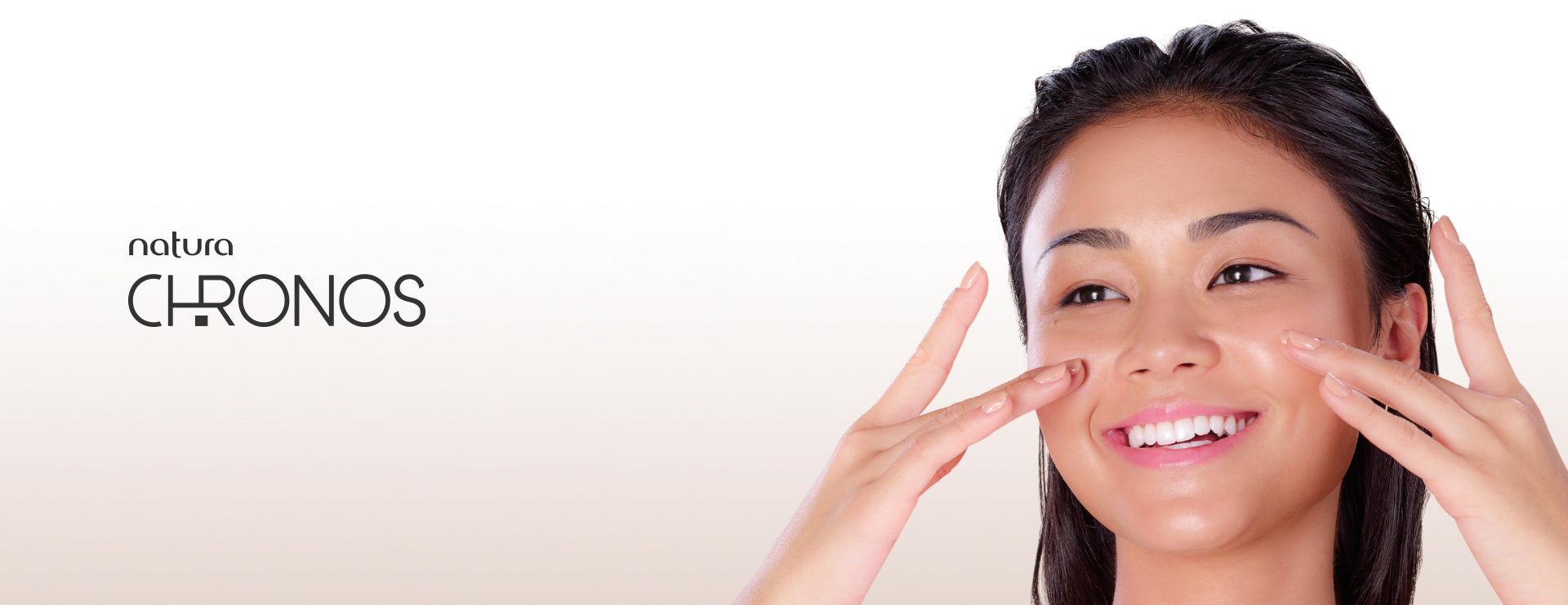 Natura Chronos Asian looking customer applying serum on face. 